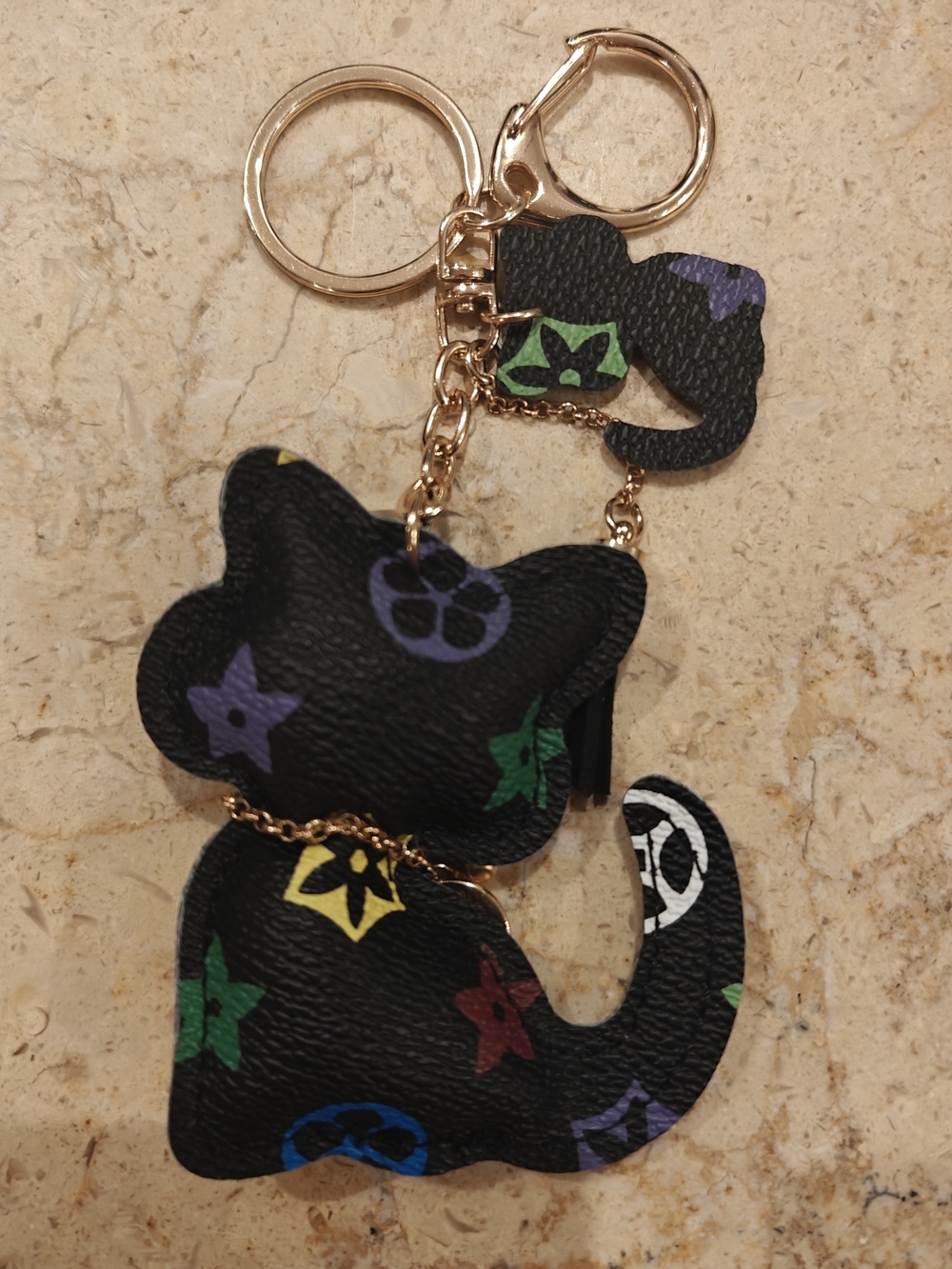 Playful Black Cat Keychain with Multicolor Motif